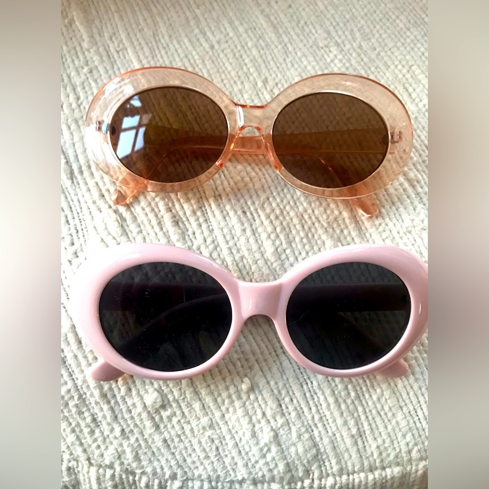 Set of two pairs of Mod Sunglasses. Clear pink and opaque pink.